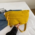 Vibrant yellow nylon crossbody bag with woven zipper pull and adjustable strap - Yellow