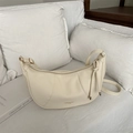 Chic cream white leather hobo bag with textured lychee grain and drawstring details - White