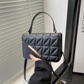 Fashionable black quilted faux leather crossbody bag with gold hardware and top handle - Black