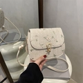Straw crossbody bag in cream white with delicate floral embroidery and gold clasp - White