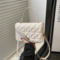 Creamy beige square crossbody bag with triangular quilting and gold buckle detail - White