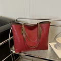 Chic brick red tote bag with deep brown straps, featuring textured faux leather finish - Red