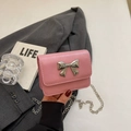 Pink mini crossbody flap bag with silver chain and bow knot on smooth shiny PU leather - Pink