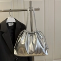 Minimalist silver metallic drawstring shoulder bag with bow detail and sleek finish - Silver