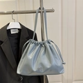 Light blue glossy pleated bucket bag with silver bow and adjustable shoulder strap - Blue