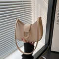 Minimalist beige half-moon shoulder bag with golden D-ring buckle and fine leather texture - Khaki