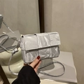 Silver woven crossbody bag with metallic finish and minimalist square flap design - Silver
