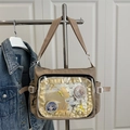 Beige canvas ita bag featuring a large clear PVC window and adjustable shoulder strap - Khaki