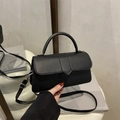 Matte black crossbody square bag with silver hardware and adjustable shoulder strap - Black