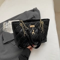 Large black quilted tote bag with gold chain strap and elegant deer charm decoration - Black