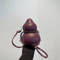 Unique gourd-shaped crossbody bag in deep burgundy matte finish with woven rope detail - Burgundy