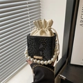 Elegant black snake-pattern box bag with pearl handle and drawstring top detail - Black