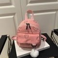 Minimochila de pana rosa con estampado de caritas sonrientes negras y pompón blanco - Rosa
