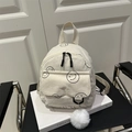 Mini mochila chic de pana crema con estampados de caras sonrientes y pompón de peluche - Blanco