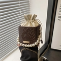 Brown snakeskin bucket bag with white drawstring inner bag and faux pearl handle - Brown