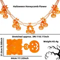 Detail of 3M Halloween orange honeycomb pumpkin banner showing open and folded states - Pumpkin Style Garland