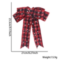 Red and black buffalo plaid Christmas bow with white snowflake pattern and dimensions - Red Black Plaid Snowflake Bow