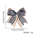 Size details of a double-layered burlap and gingham bow with snowman print for decor - Black and White Plaid