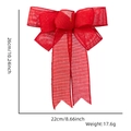 Detail of red burlap Christmas bow with dimensions 26cm x 22cm on white background - 7-Loop Bow / Red Faux Linen