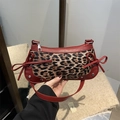 Fashionable leopard print baguette bag with burgundy leather trim and bow details - Red Leopard Print