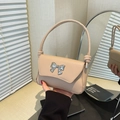 Minimalist beige square shoulder bag with a stylish silver bow clasp for women - Khaki