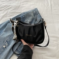 Fashionable black leather square shoulder bag with pleated design and silk scarf detail - Black