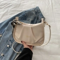 Creamy beige square shoulder bag with pleated design and decorative floral silk scarf - White