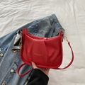 Red pleated square crossbody bag with silk scarf accent and gold lettering - Red