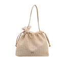 Chic beige straw bucket beach bag with drawstring closure and floral scarf accent - Khaki