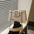 Chic cream-colored shoulder bag with oversized crystal buckle and silver chain strap - White