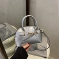 Silver metallic shell handbag with golden hardware and long crossbody shoulder strap - Silver