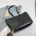 Minimalist black faux leather tote bag with wrinkled texture for daily commute style - Black