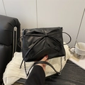 Chic black leather shoulder bag with oversized bow and silver chain strap detail - Black