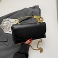 Black square shoulder bag with a unique gold safety pin handle and chain strap - Black