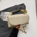 Cream leather handbag featuring a creative gold safety pin handle and chain strap - Off White