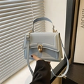 Light blue square flap bag in PU leather with gold metal twist lock and top handle - Blue