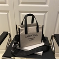 Minimalist beige canvas tote bag with black leather trim and detachable wide strap - Black