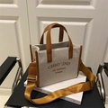 Minimalist canvas tote bag with brown leather trim and wide adjustable strap - Brown
