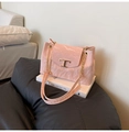 Detail of light pink marble textured bag featuring a gold metal T-buckle closure - Pink