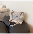 Detail of grey wrinkled leather shoulder bag with gold chain and T-shaped metal buckle - Gray