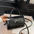 Glossy black leather square handbag with silver metal bow and adjustable shoulder strap - Black