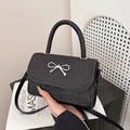 Elegante schwarze Pailletten-Handtasche mit weißer Schleife und abnehmbarem Gurt - Schwarz
