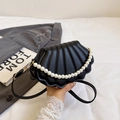 Chic black shell-shaped crossbody bag with pearl handle and leather strap for women - Black