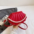 Red shell-shaped crossbody bag with pearl chain detail and quilted faux leather texture - Red
