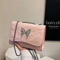 Pink crossbody bag featuring a large liquid metal butterfly and pleated texture strap - Pink