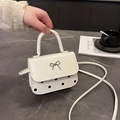 Sac bandoulière beige chic avec pois rétro et détails en métal argenté au nœud - Blanc
