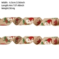Detail of Christmas burlap ribbon with gnome patterns, width 6.5cm and length 4m - Medium-Khaki Gnome