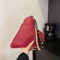 Red heart-shaped clutch in pebble leather with a colorful LOVE letter wrist strap - Burgundy