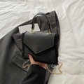 Minimalist black square crossbody bag with fringe details and metallic chain strap - Black
