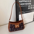 Chic brown leopard print shoulder bag with a gold metal bow and leather strap - Leopard Black
